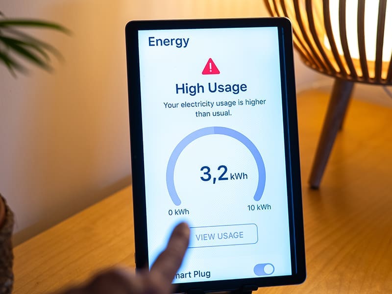 person holding a tablet with a high usage screen