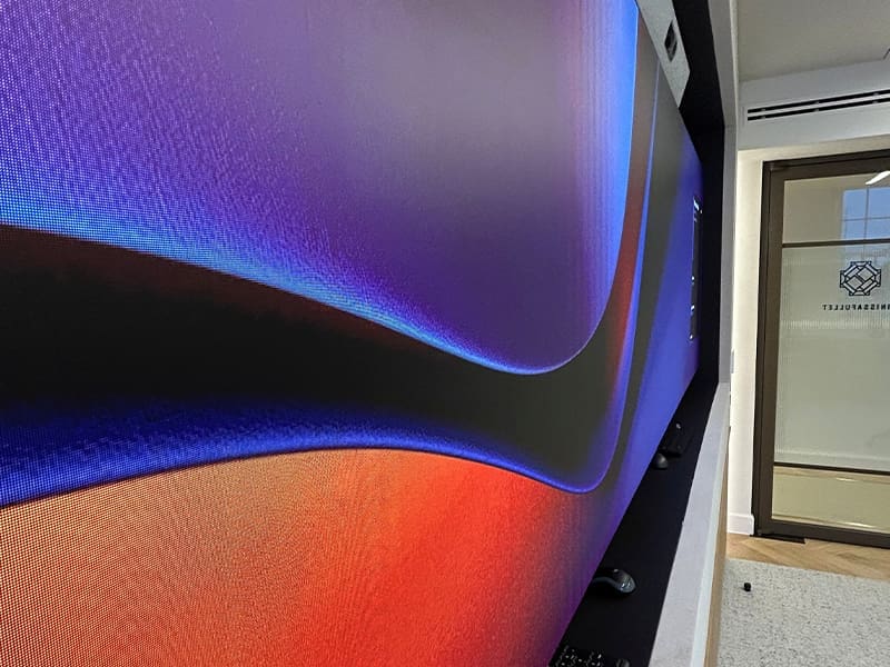 office building with a large screen on the wall