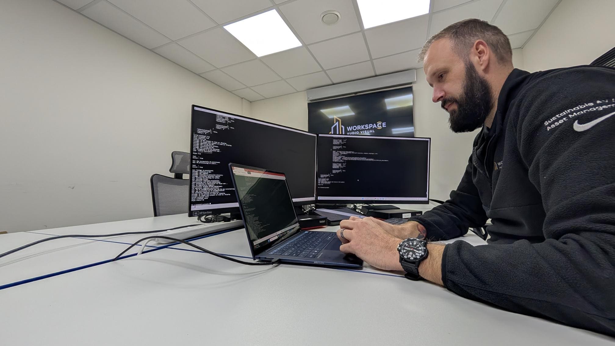 man sitting in front of a laptop computer
